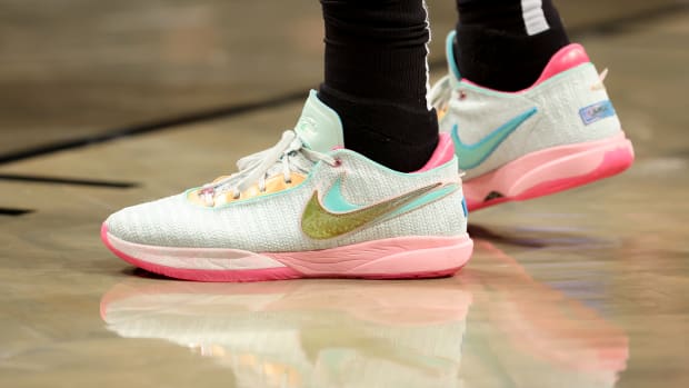 Light green and pink Nike LeBron shoes.